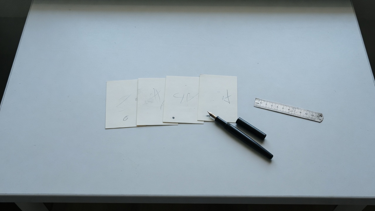 Index cards and a pen on a clean desk.
